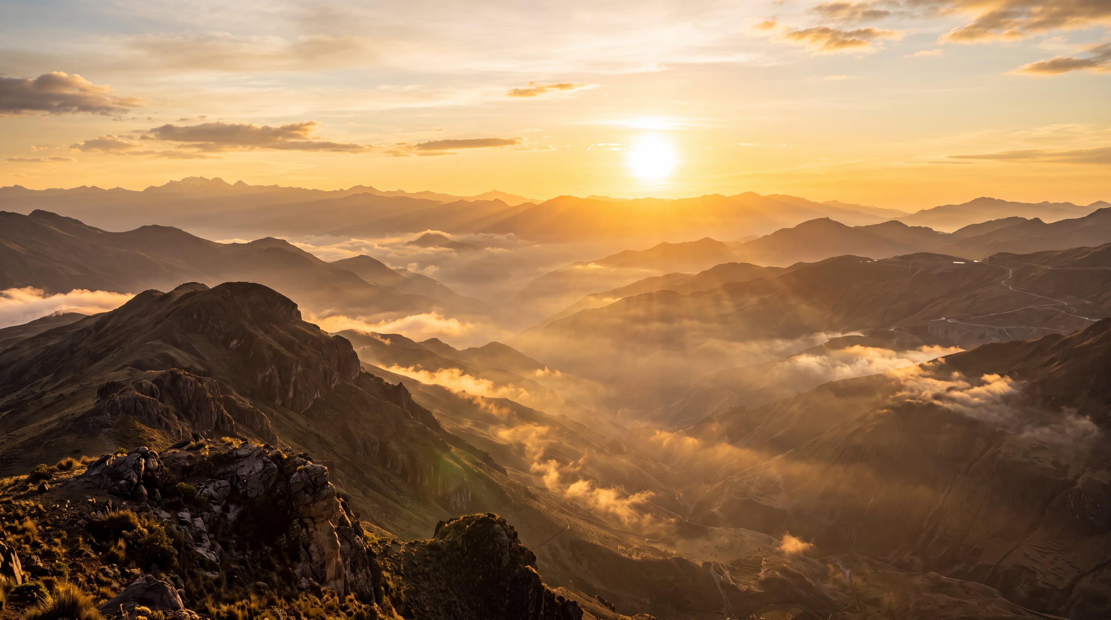 Golden sunrise over misty mountain ridges in a precious-metals mining region — Empress investor centre